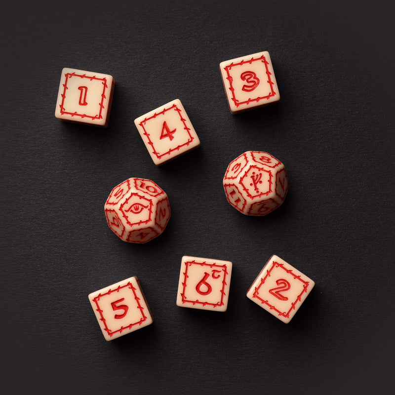 Wooden dice with red numbers on a black background