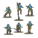Five miniature figures in military gear on a white background