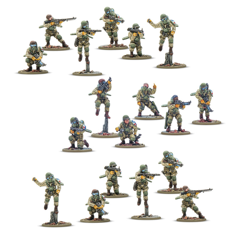Set of miniature military figures in various poses on a white background
