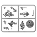 Collection of miniature figurines and accessories on a white background