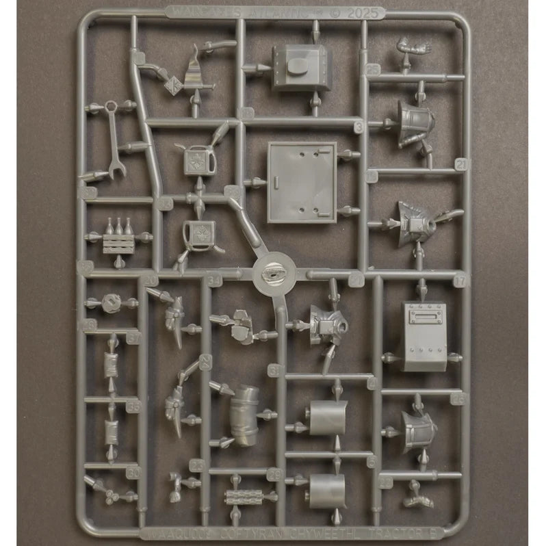 Plastic model kit components on a gray background