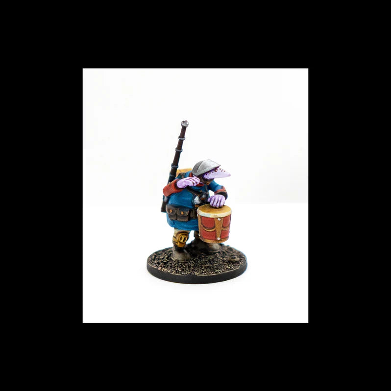 Figurine of a character with a drum and staff on a white background