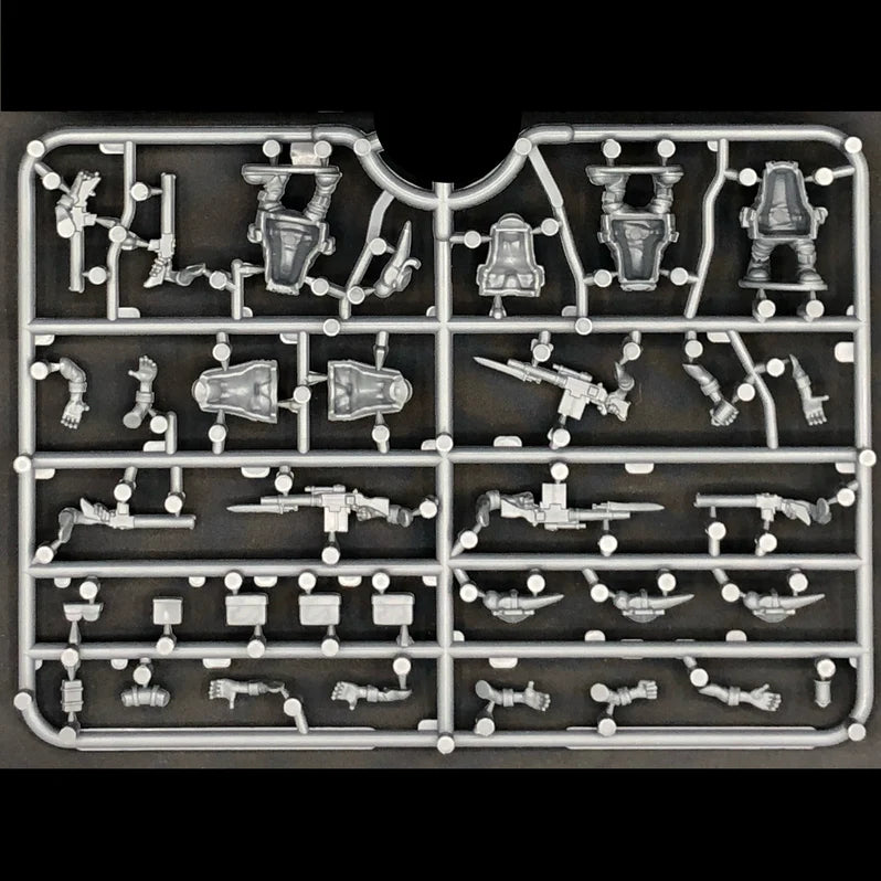Model kit parts on a black background