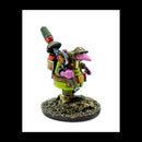 Colorful miniature figure with a green outfit and purple accents on a white background