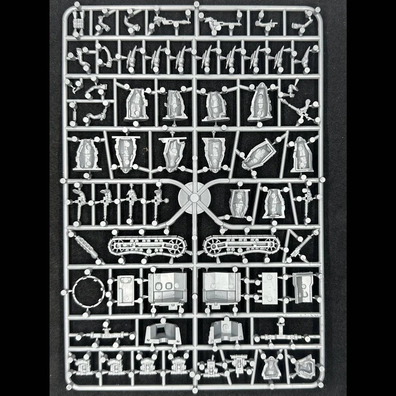 Model kit parts on a black background.