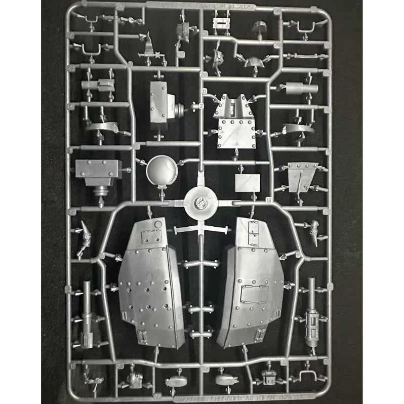 Model kit parts on a black background