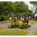 Two miniature figures on horseback with a natural background