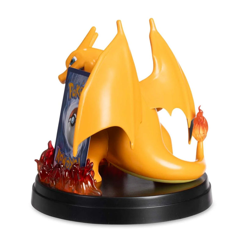 Yellow dragon-like creature figurine with red accents on a white background