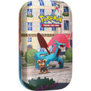Pokémon trading card game tin with a cartoon dragon-like creature and a bear-like creature on a city street background.