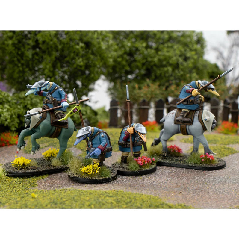 Miniature figures on horseback with weapons in a natural setting