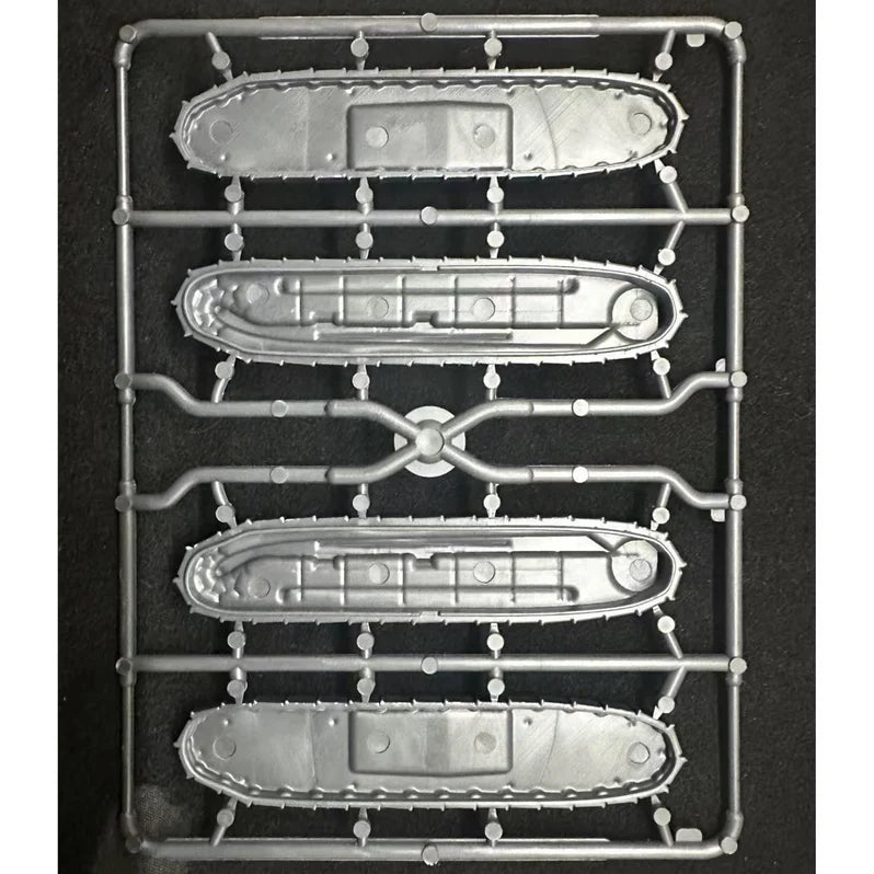 Set of model tank tracks on a black background