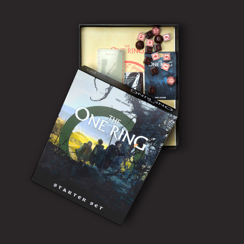 The One Ring starter set packaging with game components on a dark background
