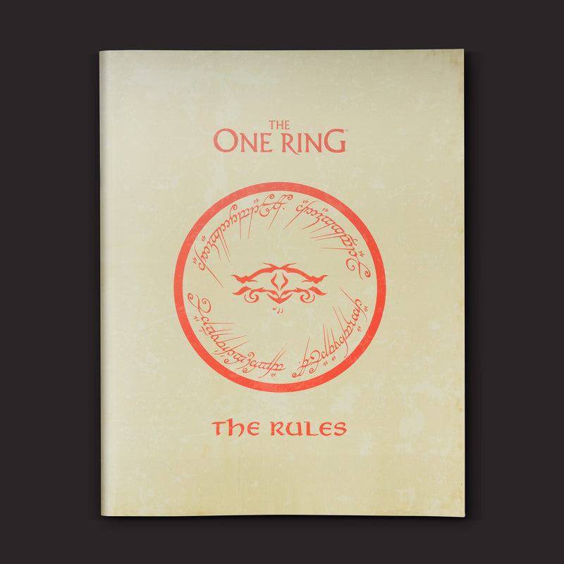 Book cover of 'The One Ring: The Rules' with a red circular emblem on beige background