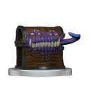 Wooden chest with a purple monster face on a white background