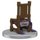 Wooden chair with a monster face on a white background