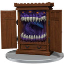 Wooden cabinet with a monster face inside on a white background