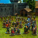 Miniature figurines of soldiers in front of a castle model