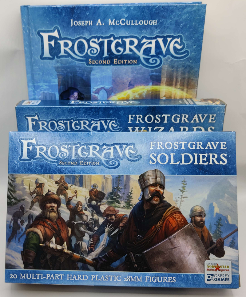 Three boxes of Frostgrave game components on a white background