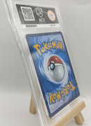 Pokémon trading card in a protective case on a stand with a white background