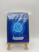 Digimon trading card deck on a small wooden stand with a white background