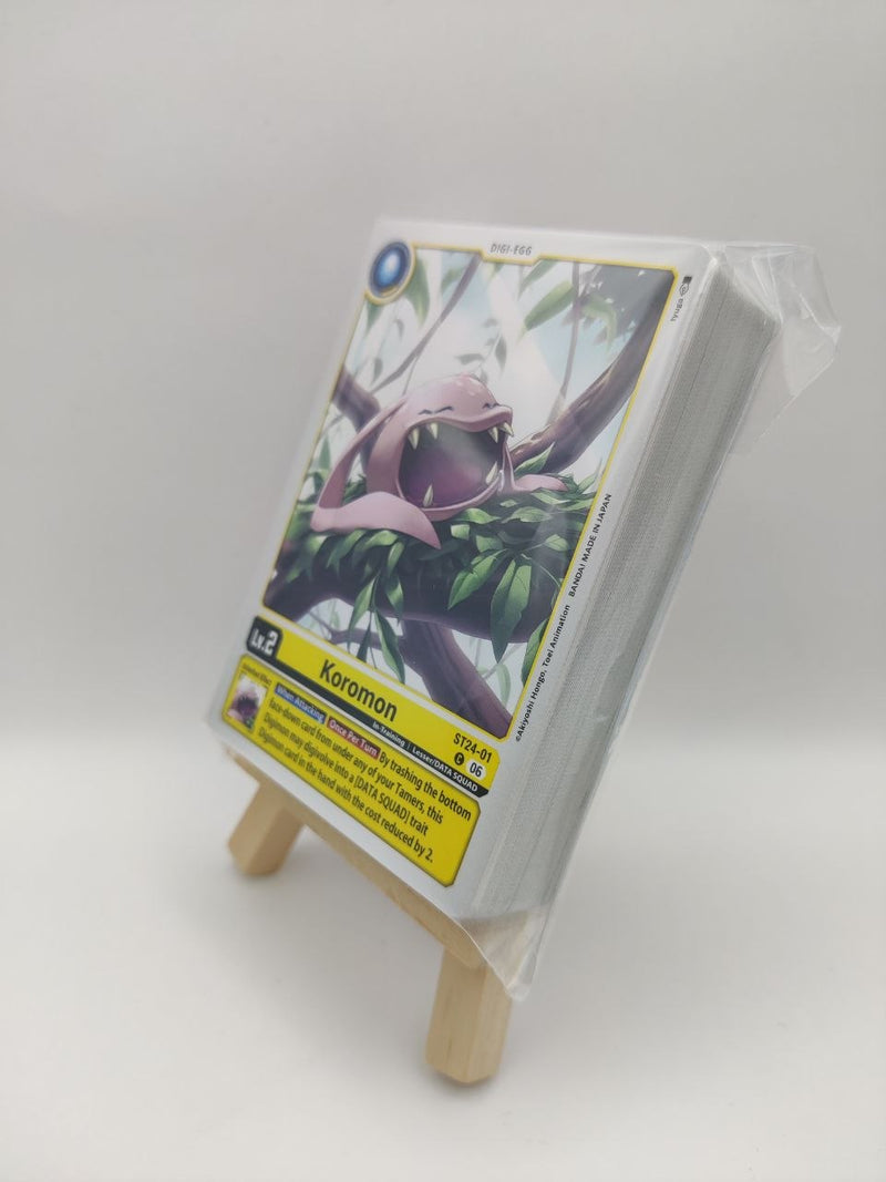 Digimon trading card deck on a small wooden stand with a white background