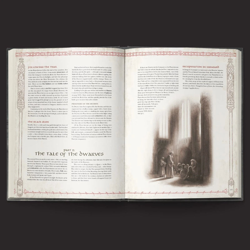 Open book with text and a black and white illustration on a dark background