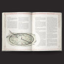 Open book with detailed illustrations and text on a dark background