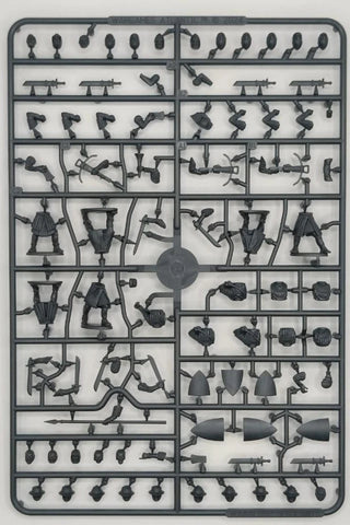 Plastic model kit with various small parts on a gray background