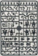 Plastic model kit with various pieces on a gray background