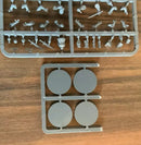 Set of model parts on a wooden surface