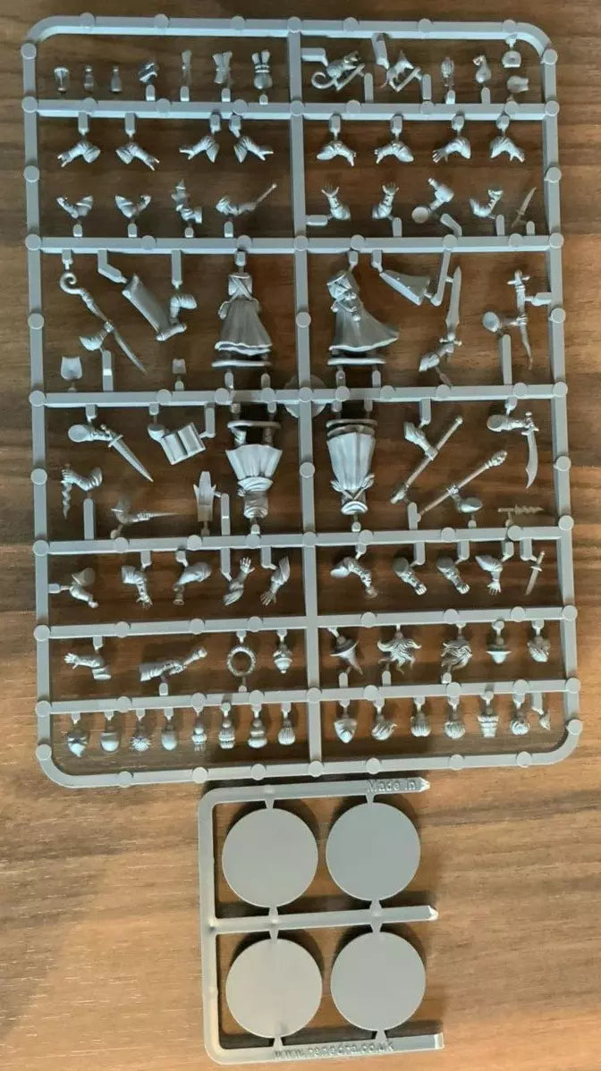 Set of plastic figurine molds on a wooden surface