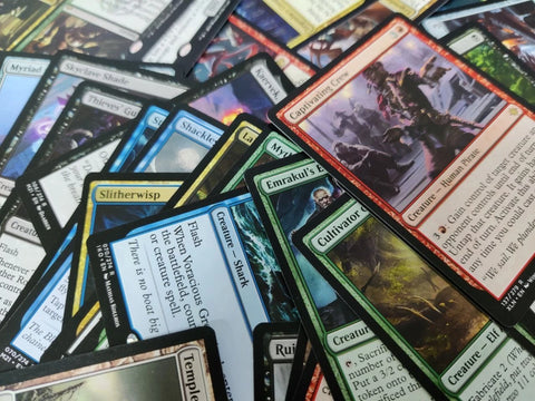 Collection of trading cards with various artwork and text