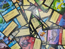 A pile of mixed Lorcana rare cards.