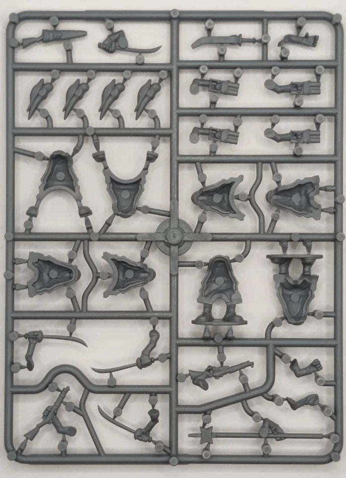Plastic model kit parts on a gray background