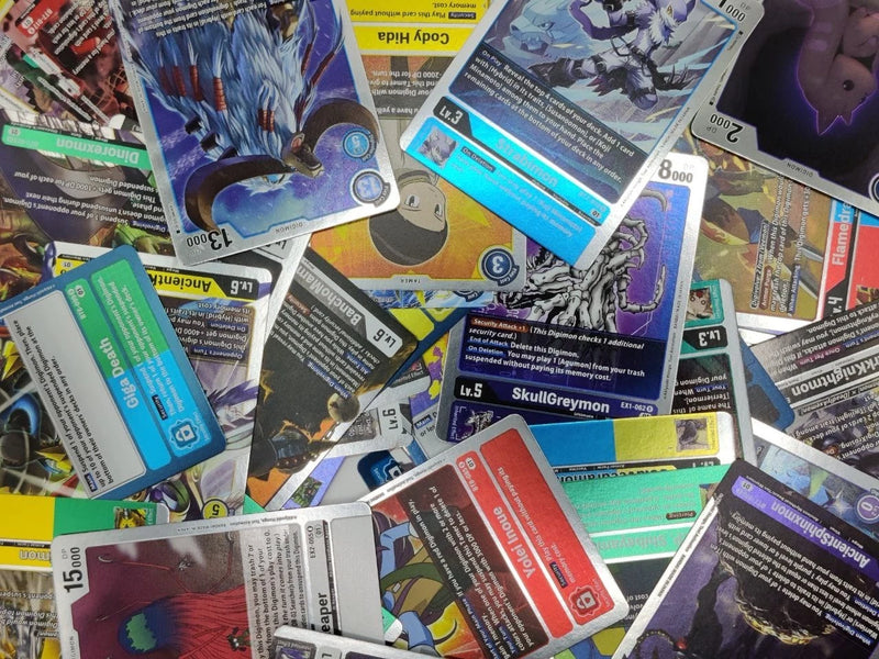 A pile of random Digimon rare cards.