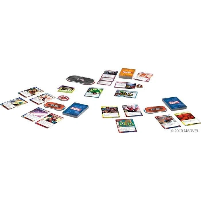 Marvel Champions card deck and accessories arranged on a plain white background, including multiple colorful cards, a black game board, and a blue Game Master box. A small Marvel copyright mark appears in the lower right.