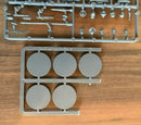 Model kit parts on a wooden surface