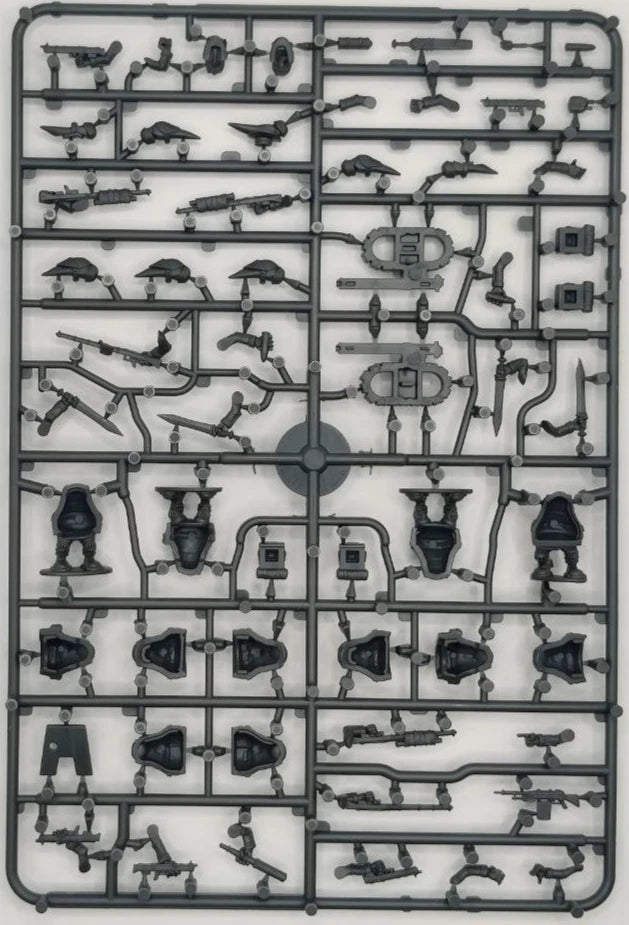 Plastic model kit tray with various miniature figures and accessories on a white background