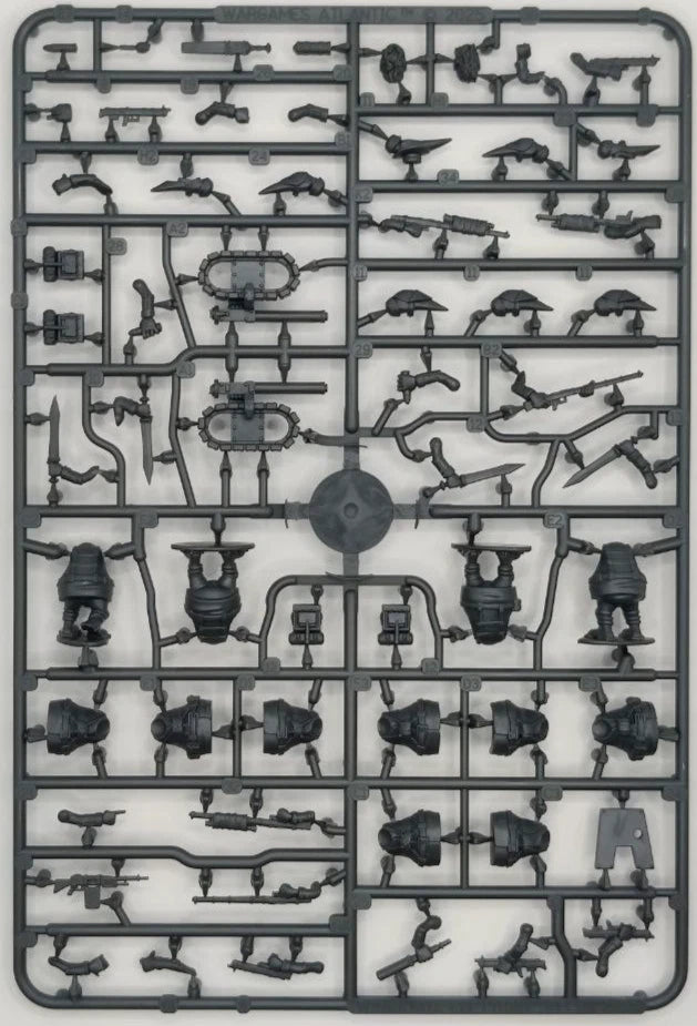 Plastic model kit with various parts on a gray background