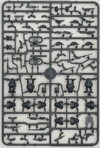 Plastic model kit with various parts on a gray background