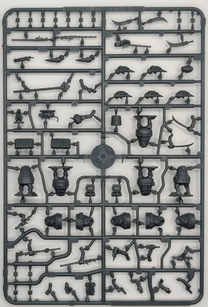 Model kit tray with various small mechanical parts on a white background