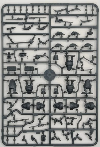 Model kit tray with various small mechanical parts on a white background